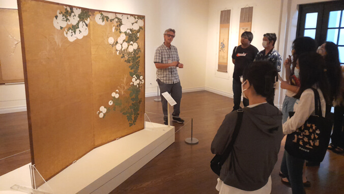 Group of people looking at exhibit