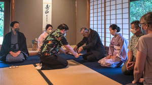 Group of people participating in tea ceremony