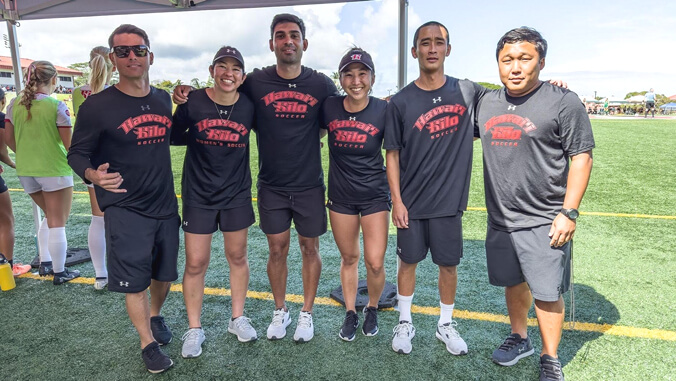 Group of people on soccer field