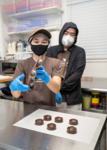 person taking chocolate out of the molds