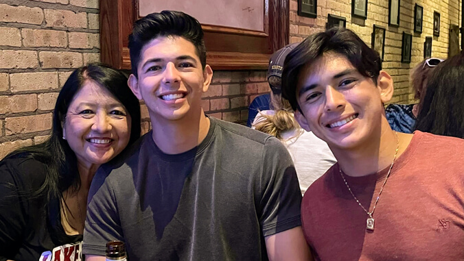 Three smiling people