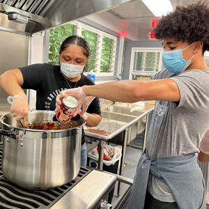 Two people cooking