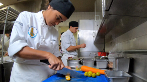 Two culinary students preparing food