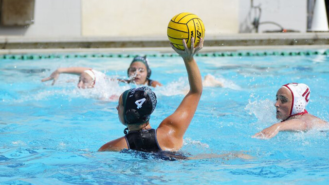 U H Manoa women water polo player in pool