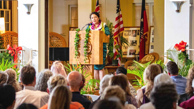 Brandy Nālani McDougall speaking at podium