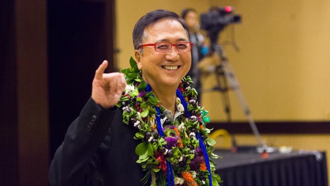 person making a shaka and smiling