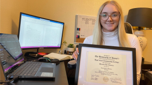 person holding diploma