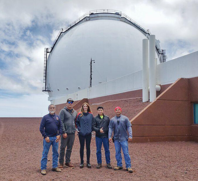 Five people standing outside Keck Observatory