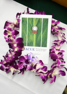 A C U E program with a lei