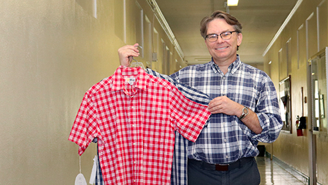 andy reilly holding palaka shirts