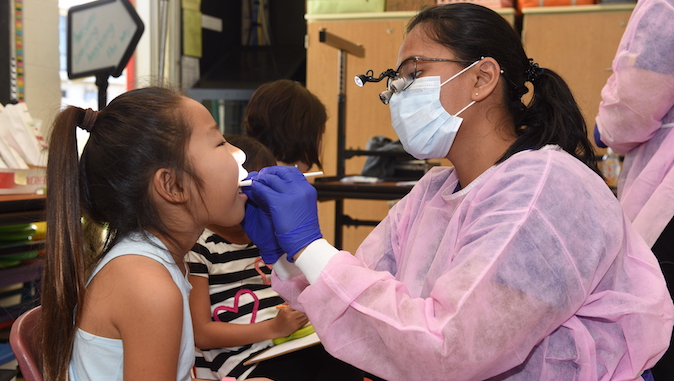 child with a dental provider