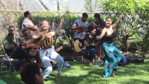 Two people performing hula
