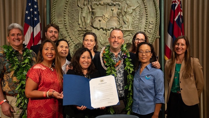 group photo with governor and uh one health team