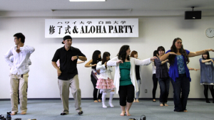 student dancing hula