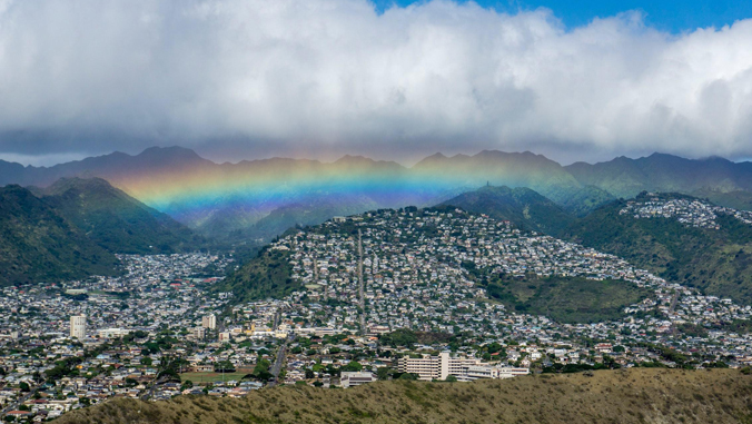 rainbow by mountains