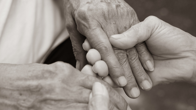 caregiver holder elder's hands