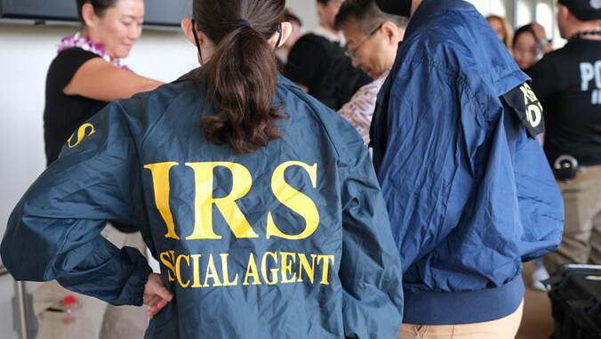 Person wearing an I R S Special Agent jacket