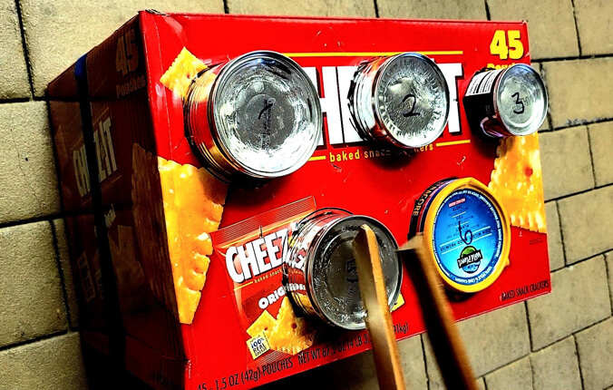 Cheez-it box with cans embedded in it