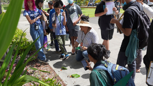 woman speaking to students