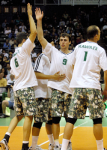 people celebrating on the volleyball court