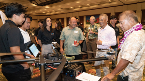 people standing around a display