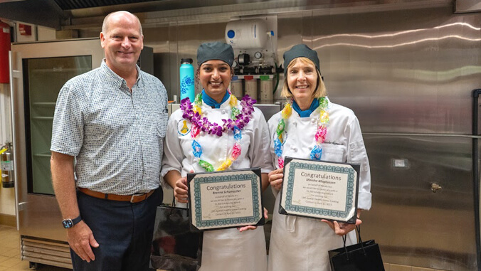 Group of people smiling with certificates