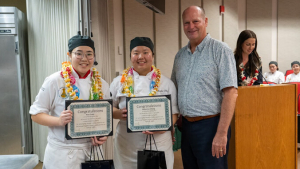 Group of people smiling with certificates