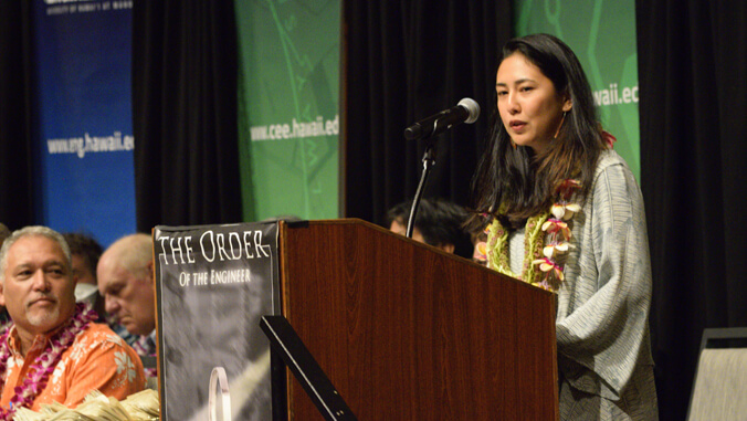 person speaking at a podium