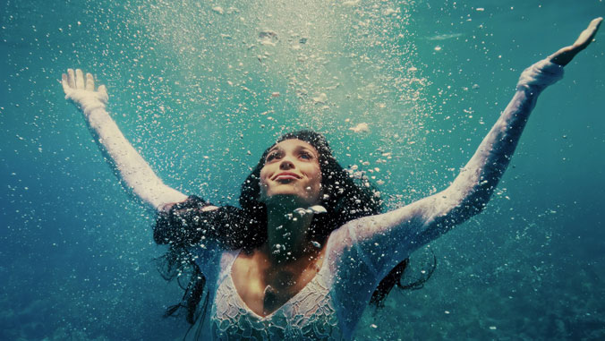 girl in ocean with bubbles