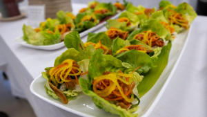 lettuce cups with sliced vegetables on a platter