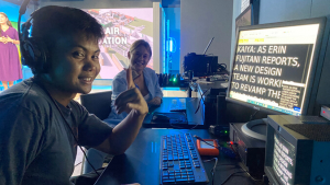 people sitting in front of a teleprompter