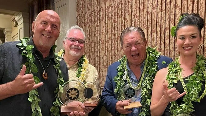 4 people with their awards