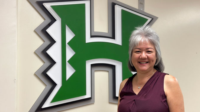 Paula Nishimoto with the H logo
