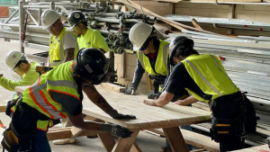 Students constructing a picnic table