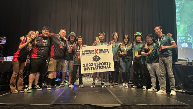 people in green and red uniforms on a stage