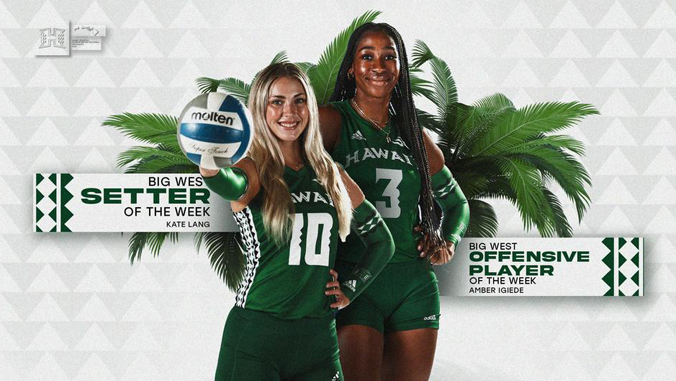 two people with green jerseys holding up a volleyball