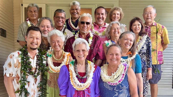 group of people wearing lei