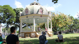 People performing at the bandstand on the grounds of Iolani Palace