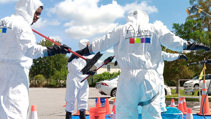 people wearing hazard suits