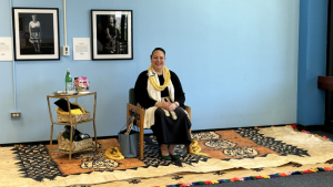 woman sitting on a chair on a mat