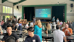 Students speaking with tech professionals