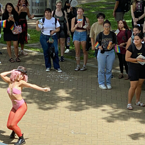 person dancing while people watch