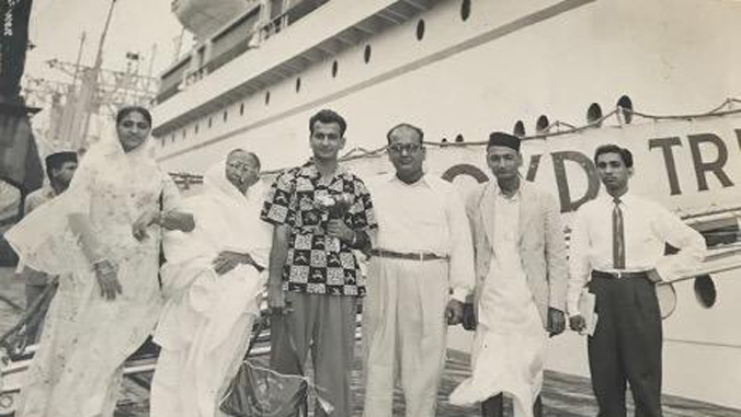 people standing in front of ship