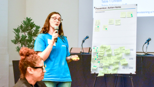 woman speaking with sticky notes