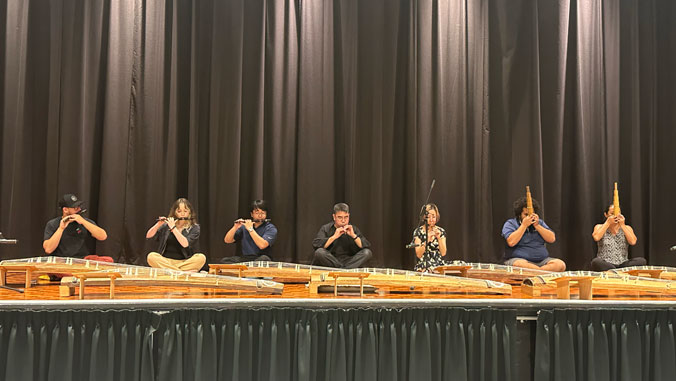 People of stage performing traditional Japanese music