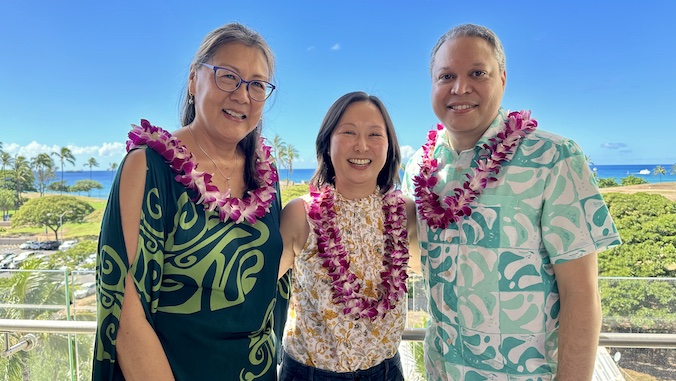 three people smiling 