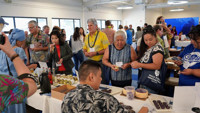 A crowd of people at the opening of the food innovation center