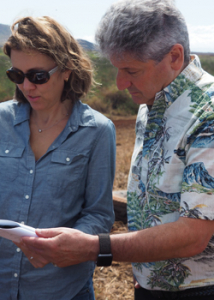 two people looking at a paper