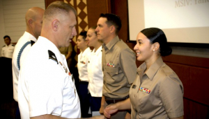 cadet is congratulated by army officer