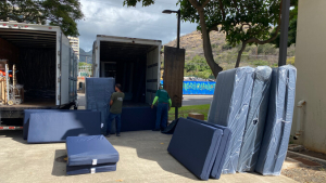 Mattresses being moved from delivery trucks